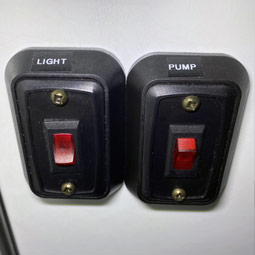 Restroom light switch/water pump power switch